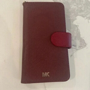 Michael Kors Phone Case/Wallet. Magnet snap close. 6” tall x 3.5” wide. Oxblood.
